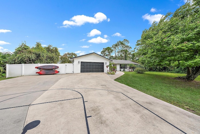 single story home featuring a garage and a front yard