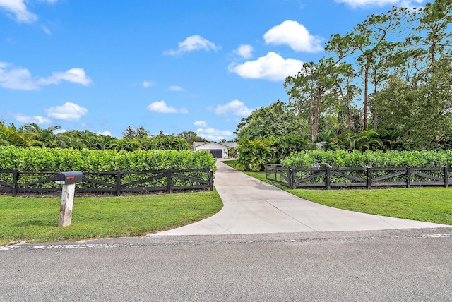 view of property's community with a yard