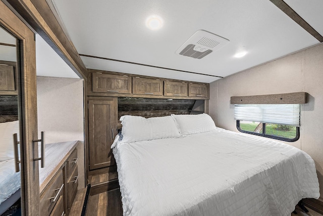 bedroom featuring dark wood-type flooring