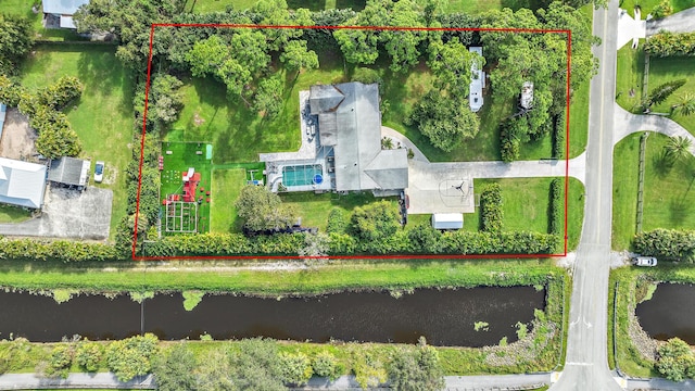 birds eye view of property featuring a water view