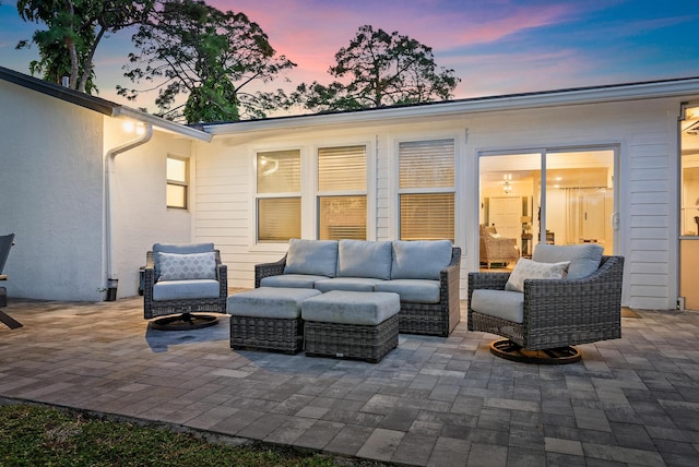 view of patio terrace at dusk