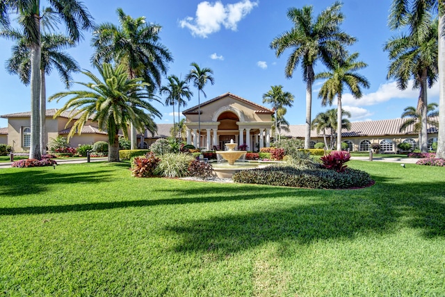 view of property's community with a yard