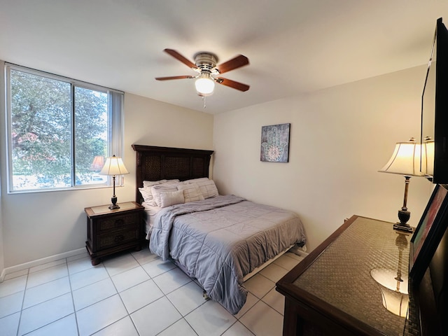 tiled bedroom with ceiling fan