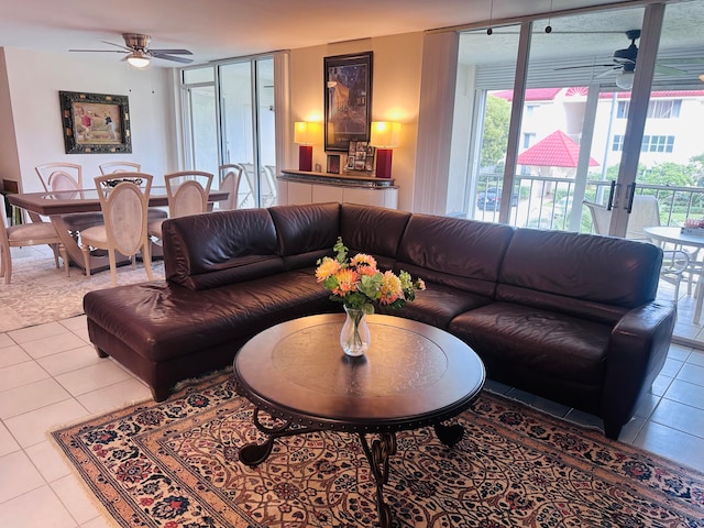 living room featuring tile patterned floors and ceiling fan