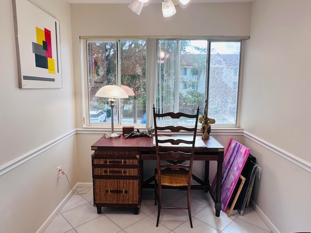 office area featuring ceiling fan, light tile patterned floors, and a healthy amount of sunlight