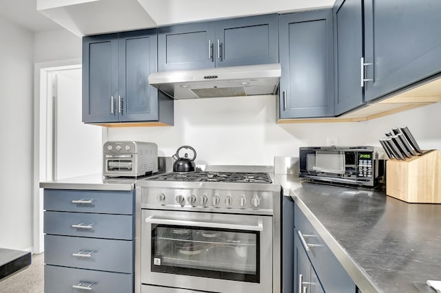 kitchen featuring blue cabinetry and high end stainless steel range oven