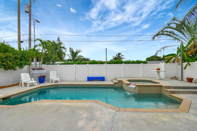 view of pool featuring an in ground hot tub and a patio