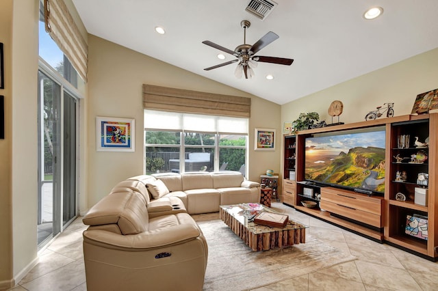 living room with light tile patterned floors, ceiling fan, and lofted ceiling