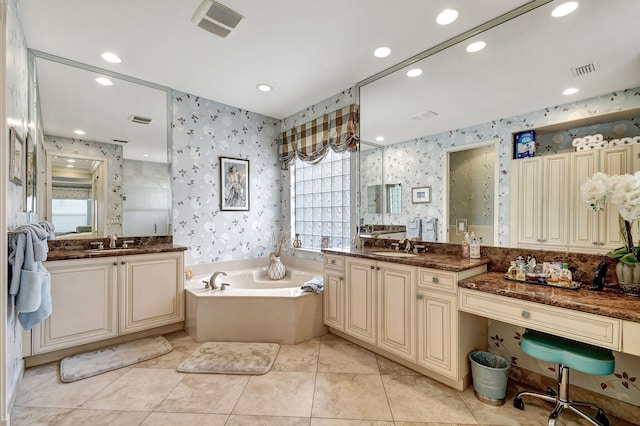 bathroom featuring tile patterned flooring, vanity, and separate shower and tub