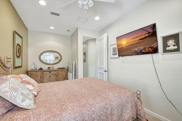 bedroom with ceiling fan and wood-type flooring