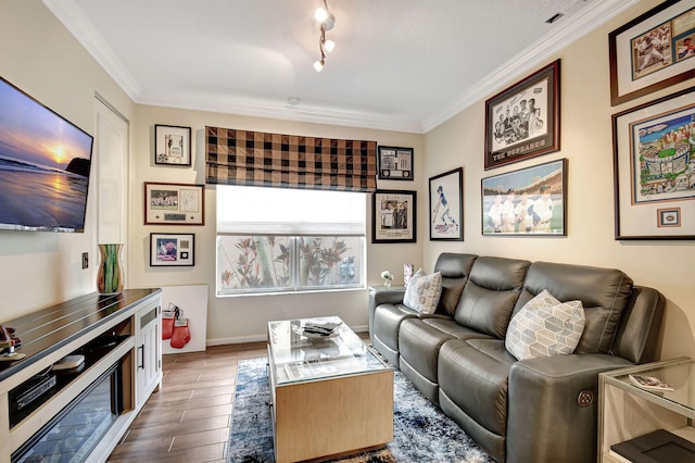 living room featuring dark hardwood / wood-style flooring and ornamental molding