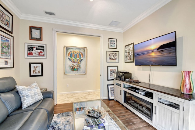 living room featuring dark hardwood / wood-style flooring and ornamental molding