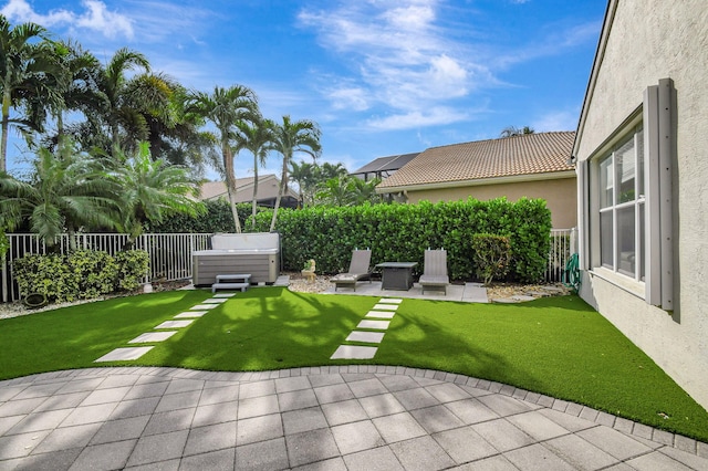 view of yard with a patio and a hot tub