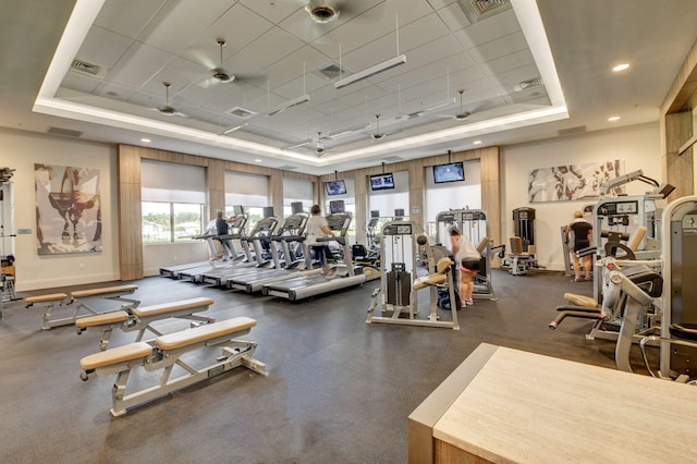 gym featuring a tray ceiling