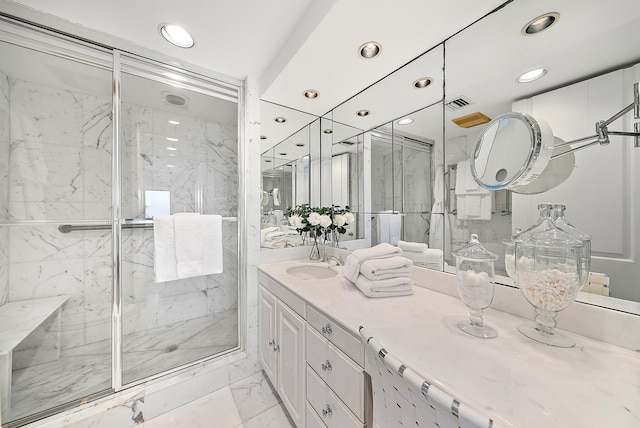 bathroom featuring vanity and an enclosed shower