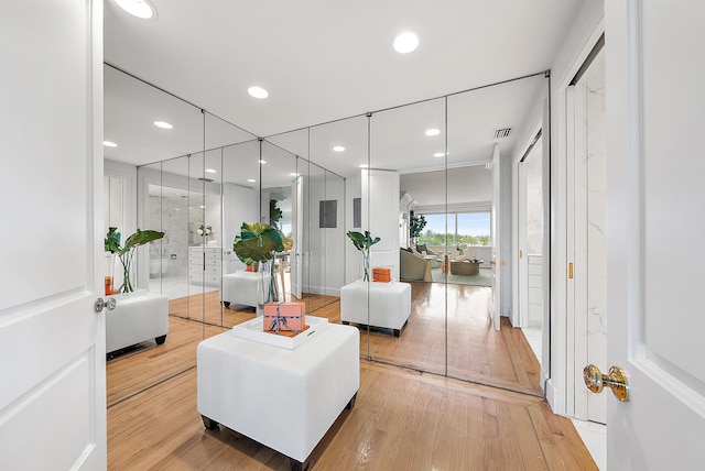 living room featuring crown molding and hardwood / wood-style floors