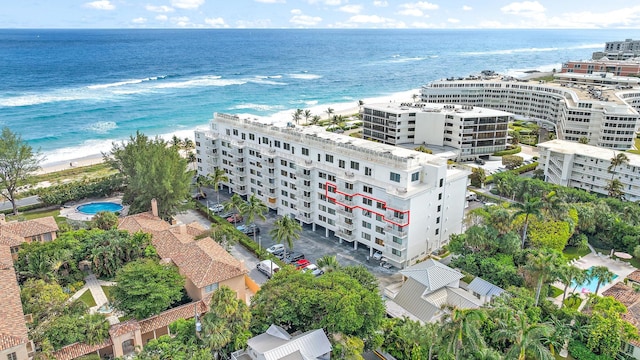 drone / aerial view with a water view and a view of the beach