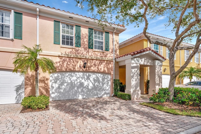 mediterranean / spanish-style home featuring a garage