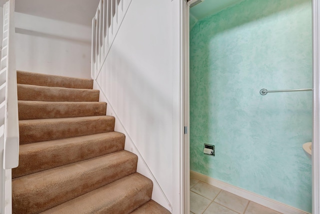 staircase with tile patterned floors