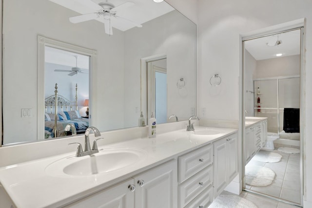 bathroom with ceiling fan, tile patterned floors, an enclosed shower, toilet, and vanity