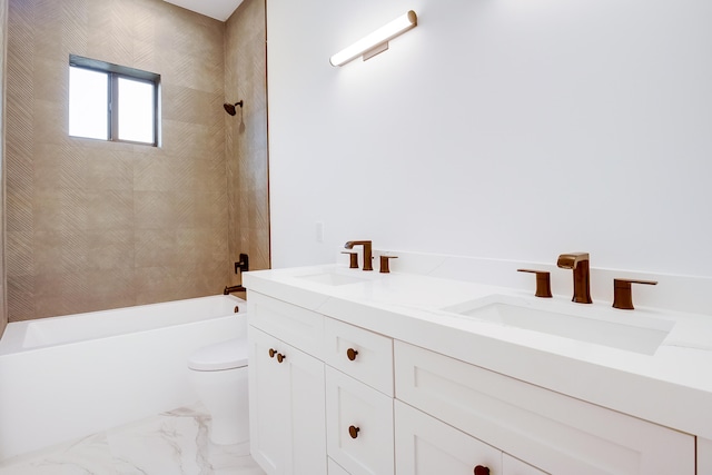 full bathroom with vanity, tiled shower / bath combo, and toilet