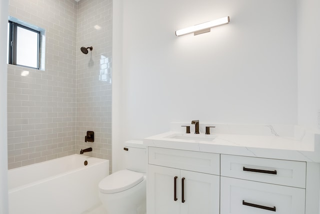 full bathroom with vanity, toilet, and tiled shower / bath