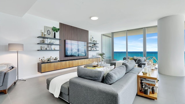 living room featuring expansive windows and a water view