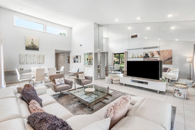 tiled living room featuring high vaulted ceiling and a textured ceiling