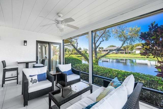 sunroom / solarium featuring ceiling fan, a water view, and wooden ceiling