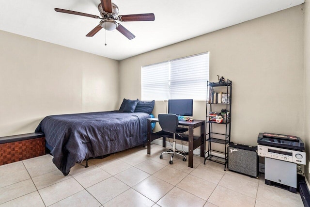 tiled bedroom featuring ceiling fan