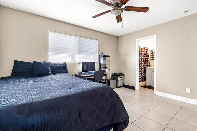 tiled bedroom featuring connected bathroom and ceiling fan