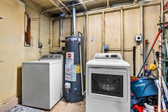 washroom with washer and clothes dryer and gas water heater