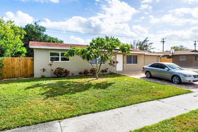 single story home with a front yard