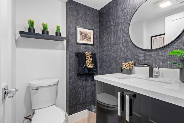 bathroom featuring toilet and sink