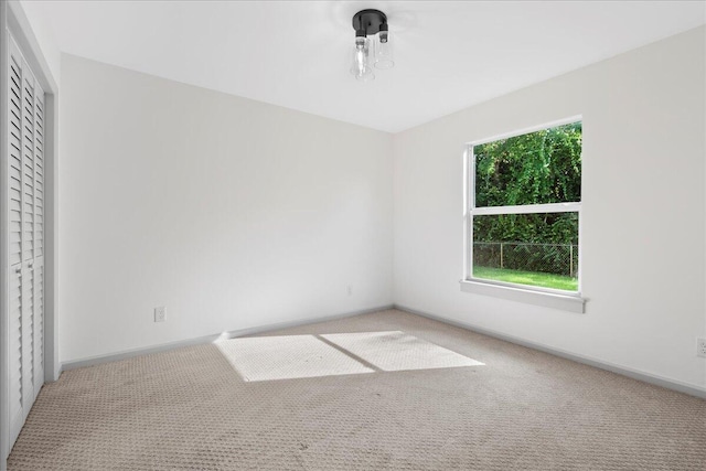 810 Bradley St, Fort Pierce, FL 34982 - unfurnished bedroom with carpet flooring, baseboards, and a closet