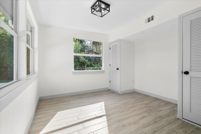 810 Bradley St, Fort Pierce, FL 34982 - unfurnished bedroom with baseboards and wood finished floors