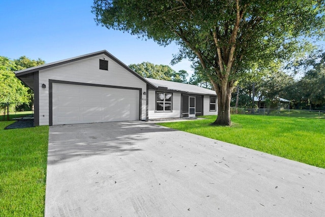 single story home featuring a front yard and a garage