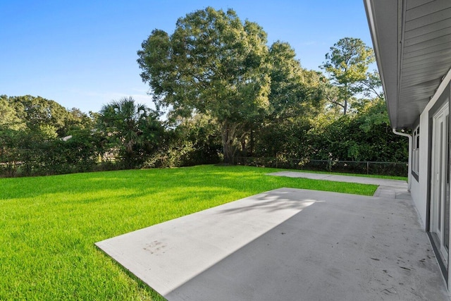 810 Bradley St, Fort Pierce, FL 34982 - view of green lawn with a patio and view of scattered trees