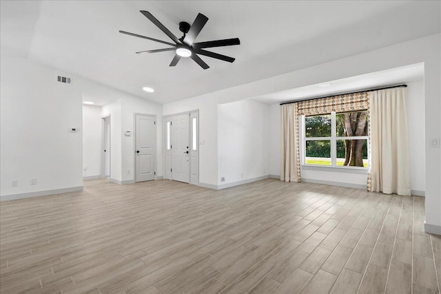 unfurnished living room with ceiling fan and light hardwood / wood-style flooring