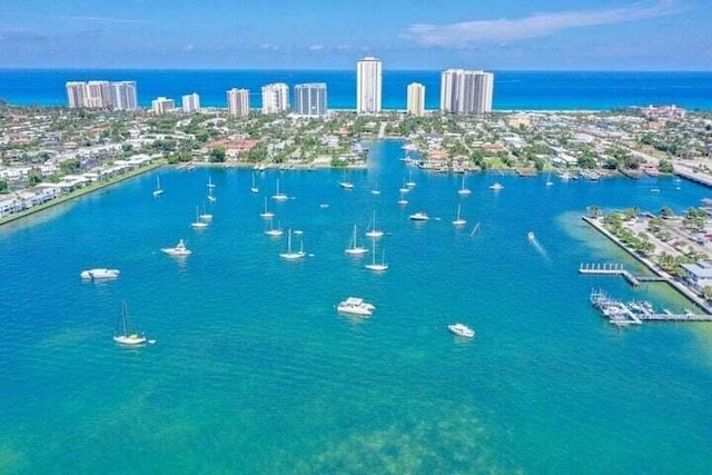 birds eye view of property featuring a water view