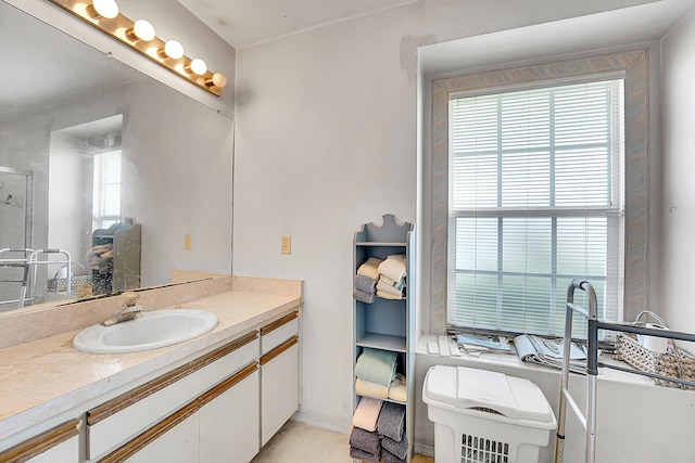 bathroom with plenty of natural light and vanity