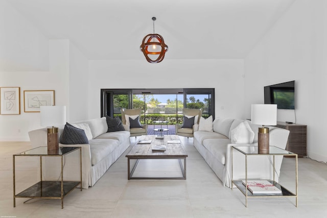 living area featuring baseboards