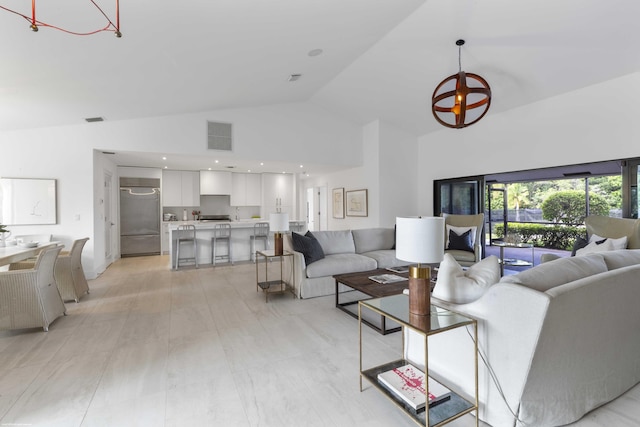 living room featuring high vaulted ceiling, visible vents, a notable chandelier, and recessed lighting