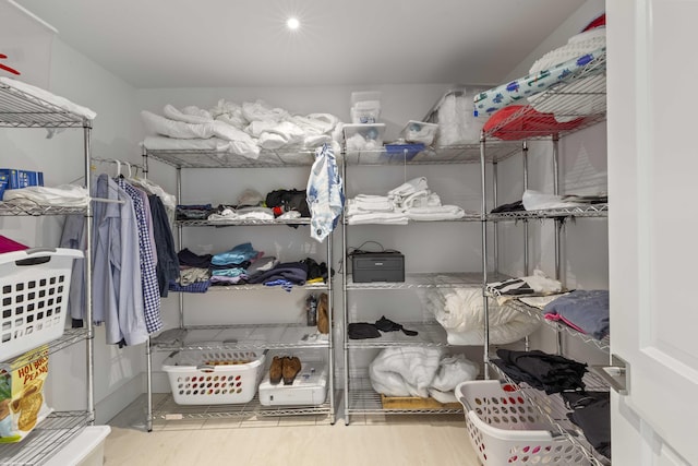 spacious closet featuring wood finished floors