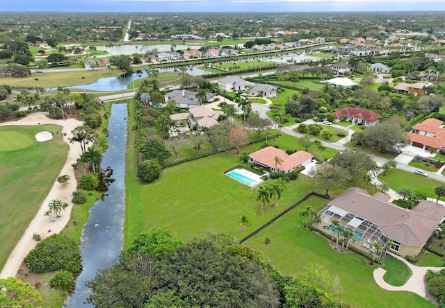 drone / aerial view featuring a water view and a residential view