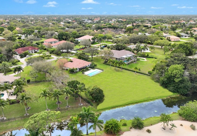 drone / aerial view with a water view and a residential view