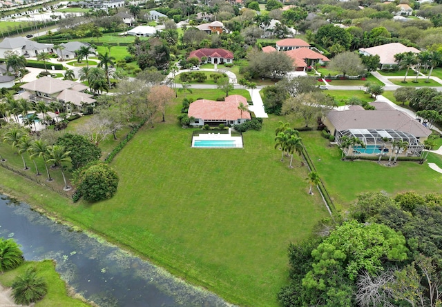 drone / aerial view featuring a residential view and a water view