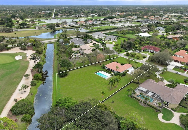 birds eye view of property with a residential view and a water view