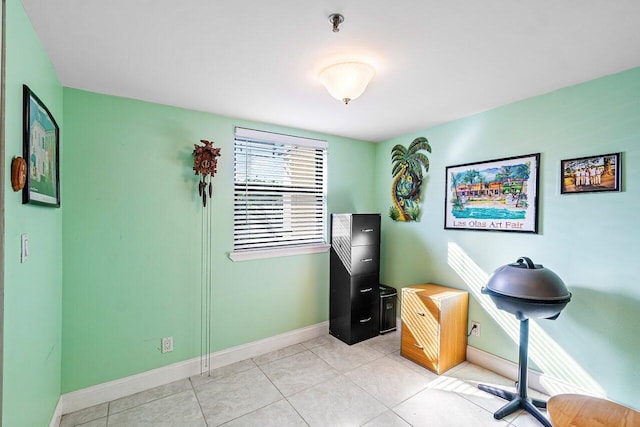 miscellaneous room with light tile patterned floors