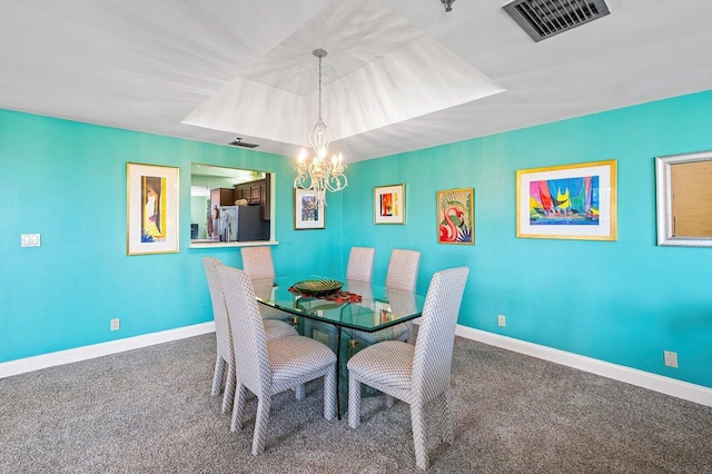 dining area featuring carpet floors and an inviting chandelier